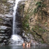 My host family and friend swam out under the waterfall, and it was cold!