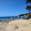 A boat-scattered shore in Tagonga, the town from which we embarked on a snorkeling adventure
