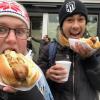 Clemente and me eating bratwurst with mustard and onions