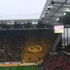 The Dortmund fans were loud and proud even though they were like an island of yellow in a sea of red