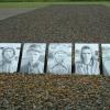 Memorial featuring the faces of Sachsenhausen prisoners 