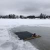 The ice hole in a frozen lake we had to swim through in order to complete that sauna visit