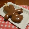 A delicious gingerbread man covered in chocolate!
