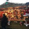 A stall at the Brugge Christmas market that sells Santa hats, scarves and other winter gear
