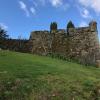 The openings you see at the top of the wall were used by archers to defend the castle