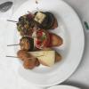 Delicious Pinchos, a typical Basque dish made with meat or fish, vegetables and cheese on top of warm bread