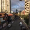 A view down a street in Viña del Mar, where the buildings are taller than in Valparaíso