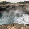 This "Devil's Breath" happens when waves crash on to the inside of an arch or cave and just a bit of vapor rises out