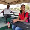 Holding my violin case while riding in a boat to my performance in Kochi, Kerala
