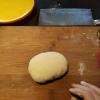 We knead the dough until it is very smooth. Once smooth, we cut it into smaller strips which we will eventually shape into our noodles. 