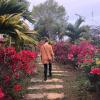 My friend Ashley walking through a garden