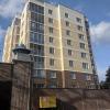 This is my apartment building. It's very new, and I live on the top floor so I have a really good view of the city!