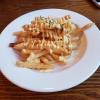 Honey butter fries from Cream's Chicken. Garlic butter is a popular flavor for fries, chips and chicken in Korea