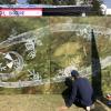 An artist, Tushar Ayveda, putting the finishing touches on a nice mural 