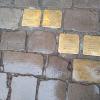 "Stolpersteine", or stumbling stones, are found in front of houses throughout Berlin as an act of remembrance