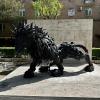 A statue of a lion made entirely of shredded car tires