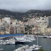 The view of Monte Carlo, the most famous district in the Principality of Monaco, on a rainy day; the second smallest country in the world is surrounded by mountains overlooking the Mediterranean Sea 
