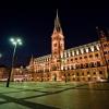 "Das Hamburger Rathaus", an impressive structure that, at night, glows brilliantly over the nearby area