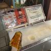 A stand that was selling maple taffy, which is made by pouring hot maple syrup onto the ice and letting it cool to make the taffy consistency