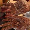 Women in the couple's family get beautiful mehendi, or henna, designs drawn on their hands and feet for the wedding! Mehendi is a paste made from leaves that dyes your skin red, like a temporary tattoo