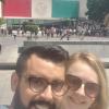 Sam and I in front of the GIANT Mexican flag at the museum of anthropology