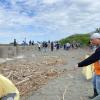 Mission #2: Beach Cleanup!  Local guides from the wetland park and teachers guide students during the beach cleanup