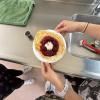 My students made crepes, and this student was particularly proud of her creation, so she wanted a picture with it! 