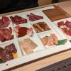 A variety of different meat and organs, served and ready to be grilled