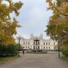 Main university building, with yellow leaves framing the walkway