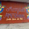 Wall art showcasing the artisanal market in El Tule 