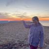 A photo my host mother took of me "holding the sun" at the top of Bolafjall Mountain in Bolungarvik, Iceland