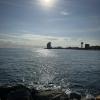 The view of the W Hotel and the ocean from a rocky pier 