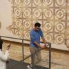 Standing in front of one of the famous ancient mosaics the city of Madaba is known for