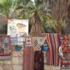 Carpets for sale, and photo of an officer in the "Jaysh" (Arabic for army)
