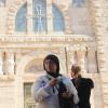 Standing in front of an ancient church in the city of Madaba