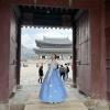 Wearing 한복 (han-bok) at 경복궁 (Gyeong-bok-gung), a palace that once housed Korean kings and queens