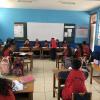 Elementary school students in gym uniforms
