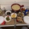 Dipping lots of food in fondue, a type of melted cheese, in Switzerland
