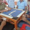 My host dad playing dominos with friends