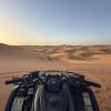 In the middle of the Sahara desert, riding ATVs