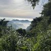 The view of mountains engulfed in fog on the hike up Datashan