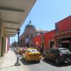 The busy streets of Oaxaca buzzed with cars, taxis and daily life and were framed by the city’s distinctive architecture that captured the vibrant energy of urban Oaxaca