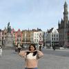 At the Grand Place (central square) of Bruges, Belgium