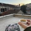 This was me drinking espresso on our balcony. I am currently reading about the history of papyrus and the how the international book trade began with Ptolemic Egypt and the Library of Alexandria. 