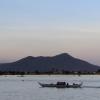 Lots of boats travel across the large Tonlé Sap River every day