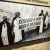 A picture thats hung in a museum it reads "respect the black people of Bahia"