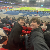 My friend and me posing at a football match in Paris, France. 