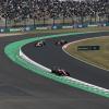 Charles Leclerc in the Ferrari and two Red Bull cars in the back 