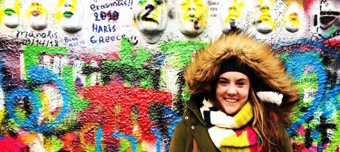 This is a picture of me in the Czech Republic by the John Lennon memorial wall! 