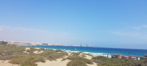 You can see Puerto del Rosario from Playa Blanca.